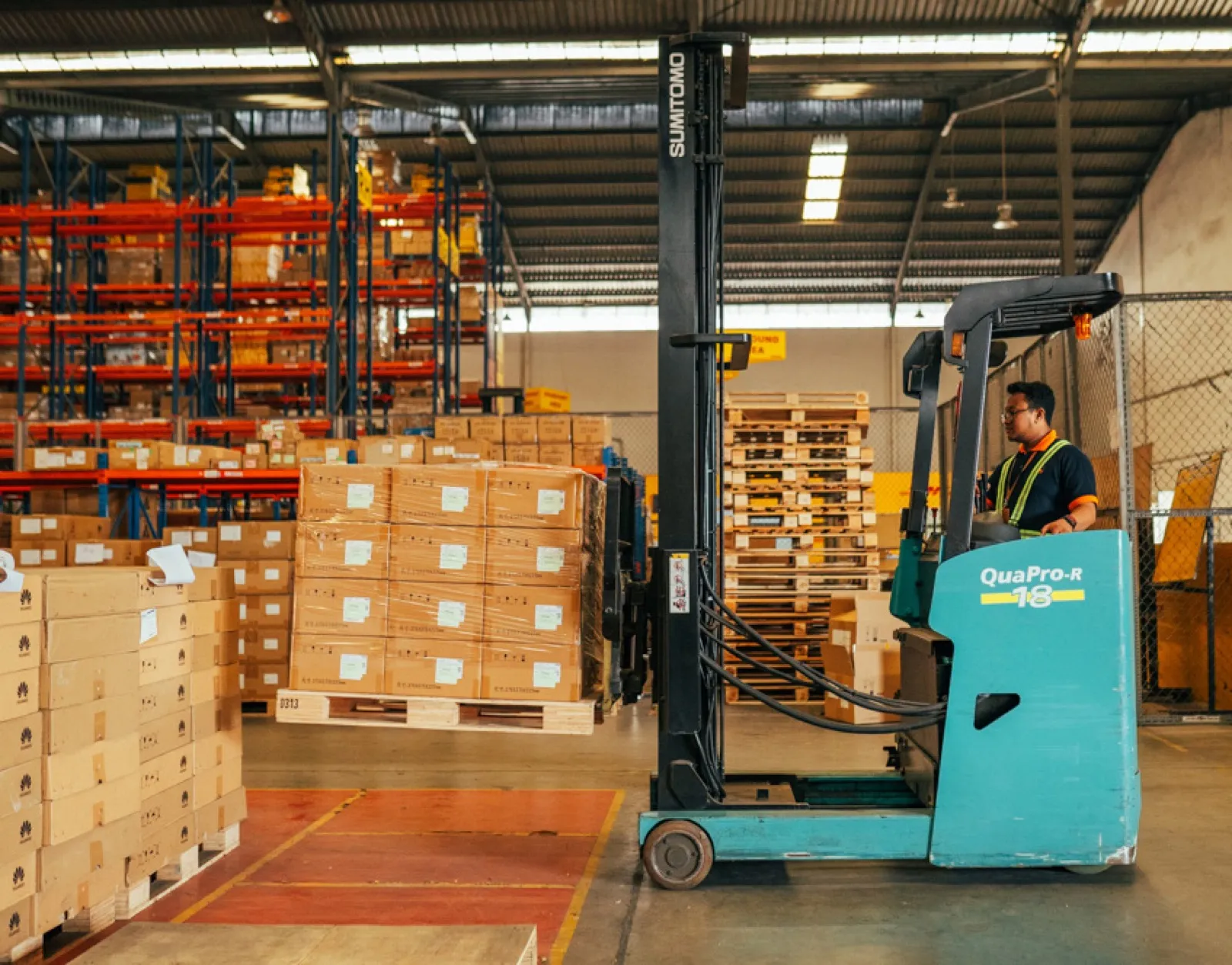 Forklift operating in a Harrasima warehouse